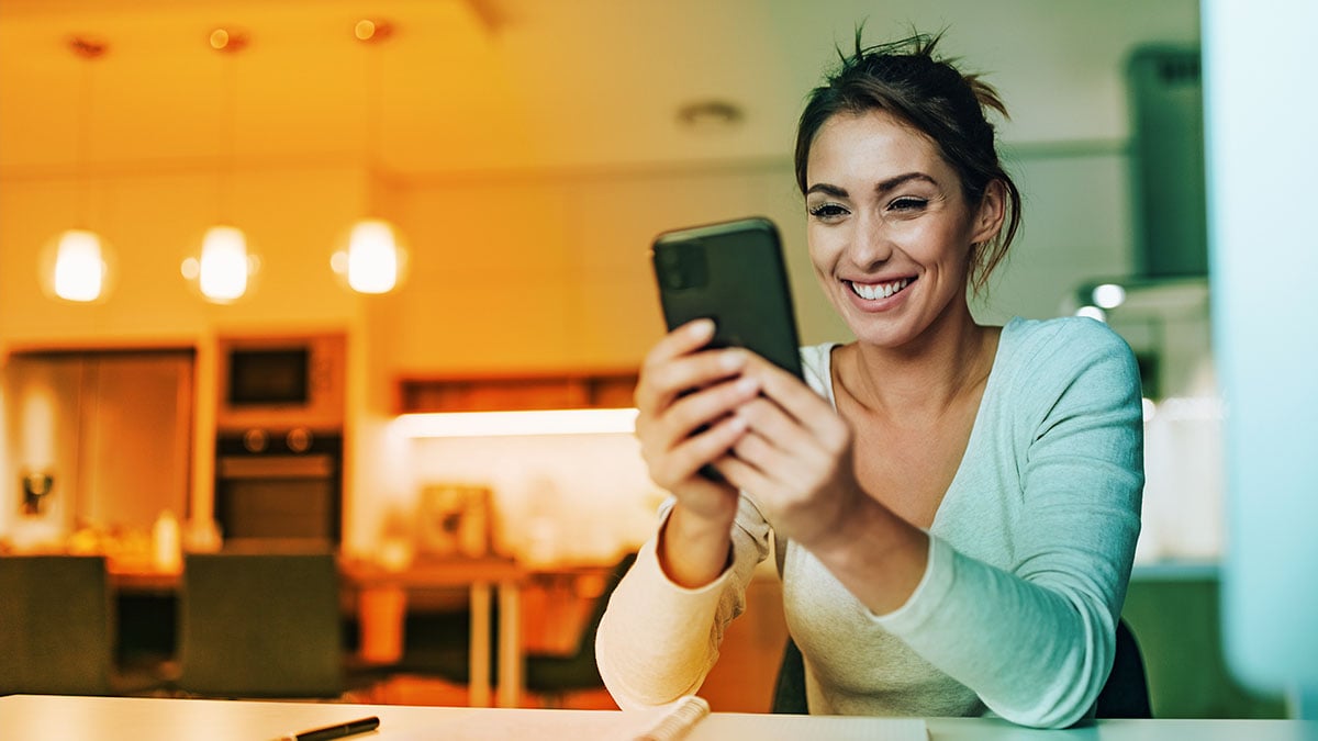 Person looking at her phone, performing a telephone mystery shop